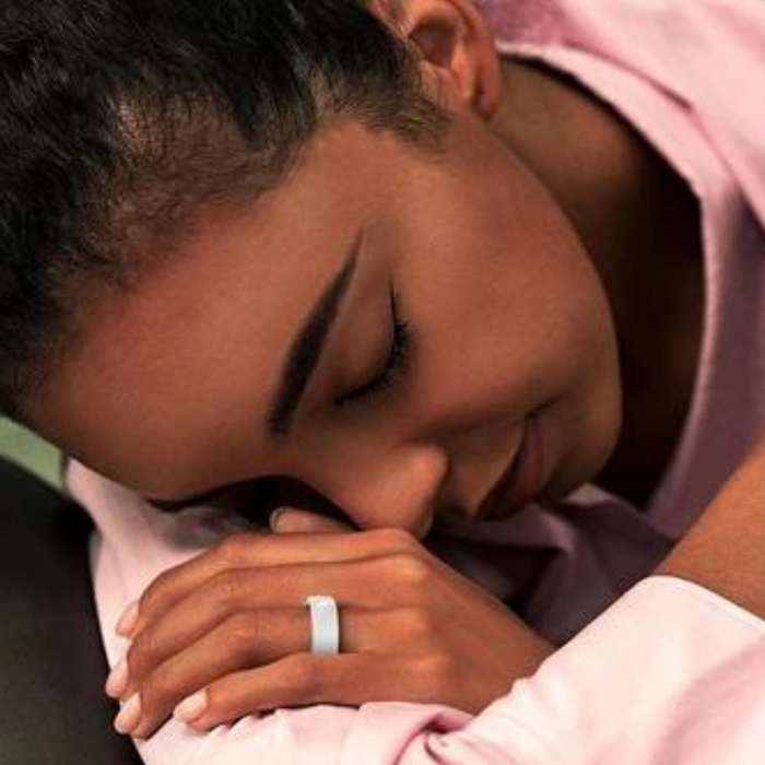 Woman resting while the Blood Pressure Smart Ring monitors body temperature – VitalityWatch